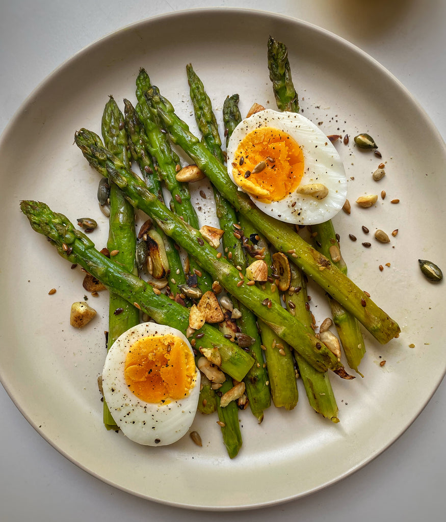 Pan Fried Asparagus With Boiled Eggs And Toasted Seeds